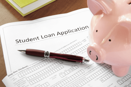 student loan application with piggy bank and pen