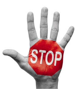Hand with a red stop sign painted on it's palm