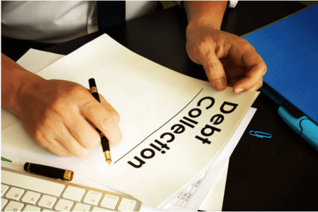 Paper with "Debt Collection" titled on it