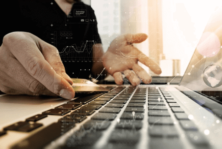 close up on hands on keyboard