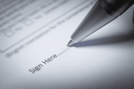 pen signing dotted line
