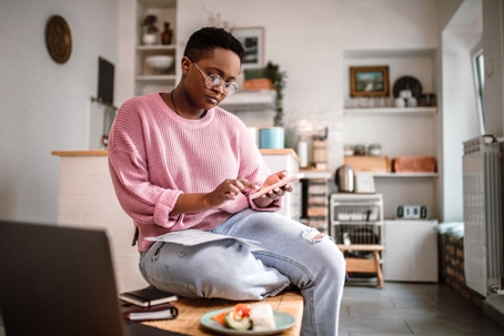 Young woman doing home finances at home