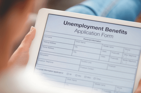 applying for unemployment benefits on tablet