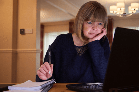 older woman looking at laptop
