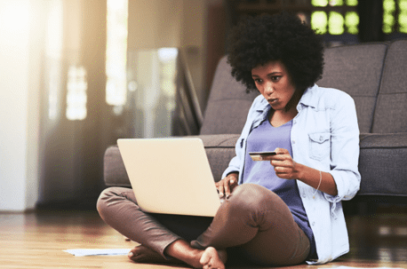 woman sitting on floor with laptop
