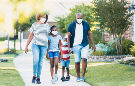 family walking on sidewalk