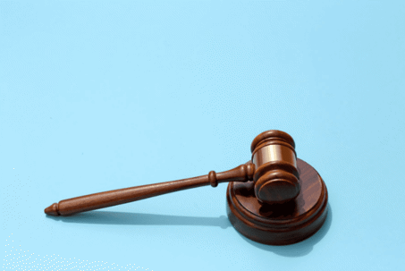 gavel on blue background