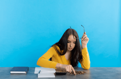 young woman counting change