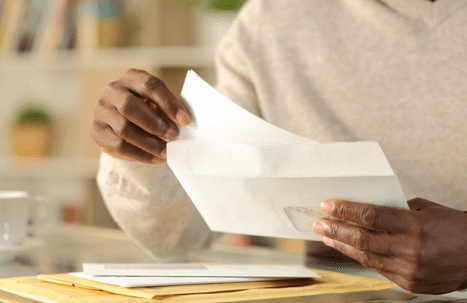 woman opening mail