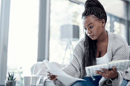 woman looking at bills