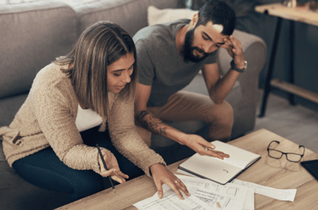 man and woman reviewing paperwork