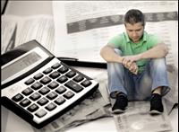 Man sitting superimposed over papers and a calculator image