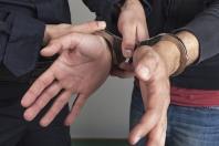 Hands in handcuffs