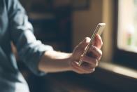 Close up of person holding cell phone