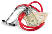 Stack of $20 dollar bills with red stethoscope set on top