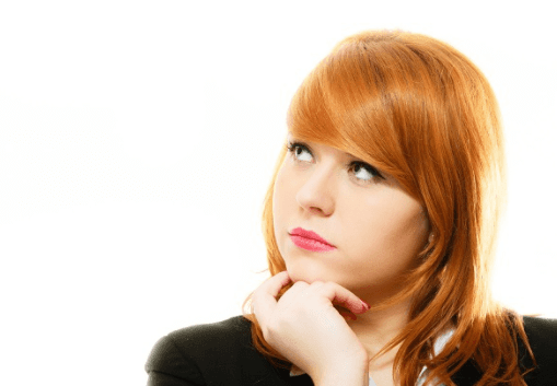 Woman looking up with hand curled under her chin