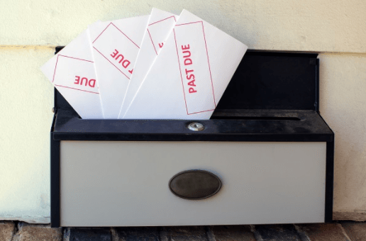 Past due letters in a mailbox