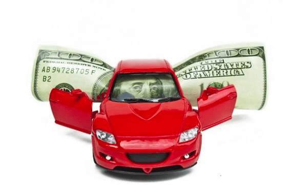 Toy red car with $100 dollar bill