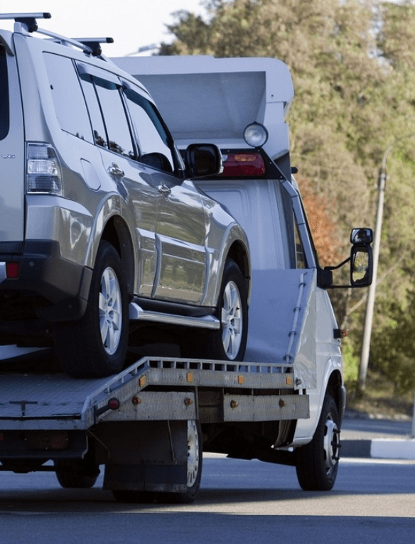 Car on the back of a tow truck