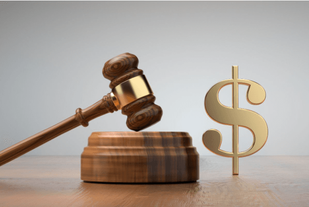 Judge's gavel and gold dollar sign